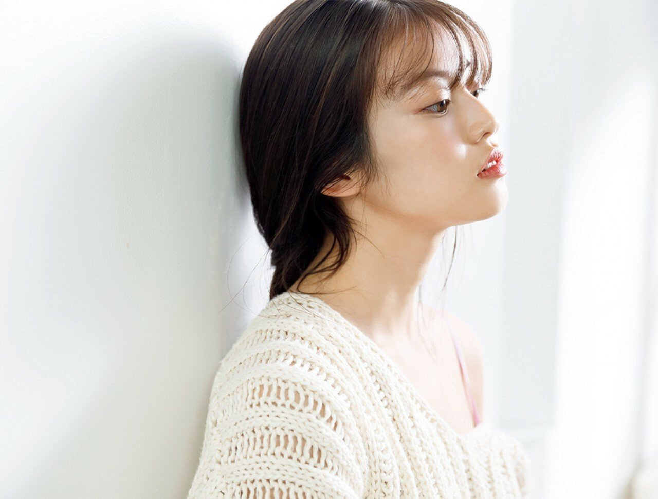 Side profile of a Japanese woman with glowing skin, highlighting the effectiveness of Japanese skincare practices.