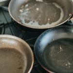 Old scratched non-stick pan with peeling coating